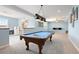 Finished game room with a pool table and views to a lower level living space and staircase at 5998 Berry Ridge Way, Castle Rock, CO 80104