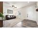 Bright living room featuring carpet flooring and a cozy couch at 5998 Berry Ridge Way, Castle Rock, CO 80104