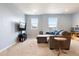 Comfortable living room featuring plush carpeting, ample natural light, and a cozy sectional sofa at 5998 Berry Ridge Way, Castle Rock, CO 80104