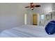 Bedroom with vaulted ceilings, ceiling fan, walk-in closet and bathroom at 10359 W Fair Ave # F, Littleton, CO 80127
