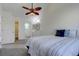Bedroom with vaulted ceilings, ceiling fan, connecting bathroom and walk-in closet at 10359 W Fair Ave # F, Littleton, CO 80127