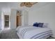 Bedroom with ceiling fan, nearby stairway and closet entrance at 10359 W Fair Ave # F, Littleton, CO 80127