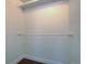 Walk-in closet offering a blank canvas with shelving rods installed at 10359 W Fair Ave # F, Littleton, CO 80127