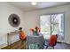 Dining area with modern decor, a view to the outside, and wood-look flooring at 10359 W Fair Ave # F, Littleton, CO 80127