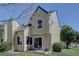 A view of the exterior showing a small patio with furniture and sliding glass doors at 10359 W Fair Ave # F, Littleton, CO 80127