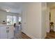 Bright living space featuring wood flooring, a door to a hall, and sliding door to the backyard at 10359 W Fair Ave # F, Littleton, CO 80127
