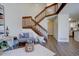 Living area with wood staircase, open floor plan, and modern decor at 10359 W Fair Ave # F, Littleton, CO 80127