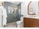 Modern bathroom features stylish tile, a glass-enclosed shower, and a sleek wooden vanity at 4655 Ludlow St, Boulder, CO 80305