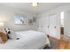 Bright bedroom with sliding closet doors and a neutral palette offers a minimalist yet cozy feel at 4655 Ludlow St, Boulder, CO 80305