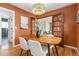 This dining room has access to other rooms through glass paned doors and features a modern light fixture at 4655 Ludlow St, Boulder, CO 80305