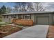 Single-story home with attached garage, attractive landscaping, and walkway leading to the entrance at 4655 Ludlow St, Boulder, CO 80305