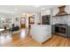 Spacious kitchen with an island, stainless steel appliances, and open flow to the adjacent living room at 4655 Ludlow St, Boulder, CO 80305