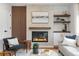 Cozy living room featuring a modern fireplace, mantel decor, and comfortable seating at 4655 Ludlow St, Boulder, CO 80305