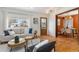 Cozy living room with natural light, modern furnishings, and an open view to the dining area at 4655 Ludlow St, Boulder, CO 80305