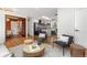 Bright living room showcasing hardwood floors, stylish furniture, and an open layout leading into the modern kitchen at 4655 Ludlow St, Boulder, CO 80305