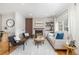 Bright living room with hardwood floors, fireplace, and large window with natural light at 4655 Ludlow St, Boulder, CO 80305