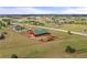 Scenic aerial view of a property featuring a barn and sprawling landscape at 2190 Helen Ct, Parker, CO 80138