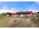 Property includes multiple red barns, storage buildings, and various pastures at 2190 Helen Ct, Parker, CO 80138