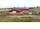 Picture of a red barn with a green roof on a large parcel of land at 2190 Helen Ct, Parker, CO 80138
