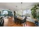 Spacious dining room features hardwood floors, large windows, and modern lighting at 2190 Helen Ct, Parker, CO 80138