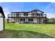 Spacious two-story home with a large balcony overlooking a lush green lawn at 2190 Helen Ct, Parker, CO 80138