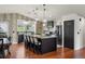 Eat-in kitchen with stainless steel appliances, island and pendant lighting at 2190 Helen Ct, Parker, CO 80138