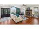 Bright living room features vaulted ceiling, stone fireplace, and hardwood floors at 2190 Helen Ct, Parker, CO 80138