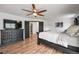 Spacious main bedroom features updated floors, a ceiling fan, and modern decor at 2190 Helen Ct, Parker, CO 80138