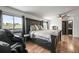 Bright main bedroom features large windows with views, and a modern ceiling fan at 2190 Helen Ct, Parker, CO 80138