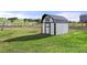 Charming outbuilding with a gable roof on a well-manicured lawn at 2190 Helen Ct, Parker, CO 80138