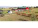 Overview of the property with fencing, pasture, and multiple barns and sheds at 2190 Helen Ct, Parker, CO 80138