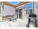 Spacious patio area with barbecue grill and comfortable seating, perfect for outdoor entertaining at 23110 York Ave, Parker, CO 80138