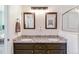 Bathroom featuring a double vanity, granite countertops, and modern mirrors at 23110 York Ave, Parker, CO 80138