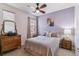 Comfortable bedroom with ceiling fan, large window, and decorative furnishings at 23110 York Ave, Parker, CO 80138