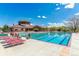 Resort-style community pool featuring covered seating areas and well-maintained landscaping at 23110 York Ave, Parker, CO 80138