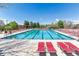 Spacious community pool with ample lounge chairs for relaxation and enjoyment by residents at 23110 York Ave, Parker, CO 80138