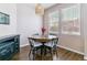 Cozy breakfast nook with round table, modern chairs, and lots of natural light at 23110 York Ave, Parker, CO 80138