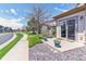Charming front porch with potted flowers, manicured landscaping, and sliding glass door entry at 23110 York Ave, Parker, CO 80138