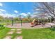 Community playground with slide and swings for children to enjoy in a green space at 23110 York Ave, Parker, CO 80138
