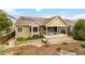 Expansive backyard with covered patio, bridge, and xeriscaping with artificial turf, great for low maintenance at 2724 Rising Moon Way, Castle Rock, CO 80109