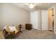 This spare bedroom has a ceiling fan, chair, and a closet with sliding doors at 2724 Rising Moon Way, Castle Rock, CO 80109