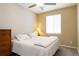 Cozy bedroom features a ceiling fan and a comfortable bed with a patterned bedspread at 2724 Rising Moon Way, Castle Rock, CO 80109