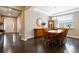 Formal dining room featuring hardwood floors, tray ceiling, and contemporary chandelier at 2724 Rising Moon Way, Castle Rock, CO 80109