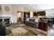 Spacious living room with fireplace, neutral colors, open floor plan, and hardwood floors at 2724 Rising Moon Way, Castle Rock, CO 80109