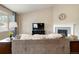 Cozy living room features a fireplace, mounted television, and comfortable seating area at 2724 Rising Moon Way, Castle Rock, CO 80109