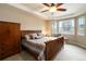 Comfortable bedroom features a ceiling fan, a large bed, and a bay window with outdoor views at 2724 Rising Moon Way, Castle Rock, CO 80109