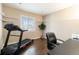 Home office with hardwood flooring, a window, and a treadmill at 2724 Rising Moon Way, Castle Rock, CO 80109
