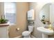 Stylish powder room with modern fixtures, decorative accents, and natural light at 2724 Rising Moon Way, Castle Rock, CO 80109