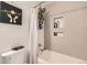 Bright bathroom with modern white and gray tiling, and a shower with sleek fixtures at 6213 Willow Ln, Boulder, CO 80301