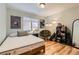 Relaxing bedroom with natural light, hardwood floors, and a comfortable seating area, creating a serene retreat at 6213 Willow Ln, Boulder, CO 80301